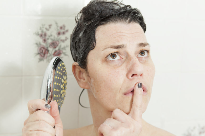 Woman thinking in shower